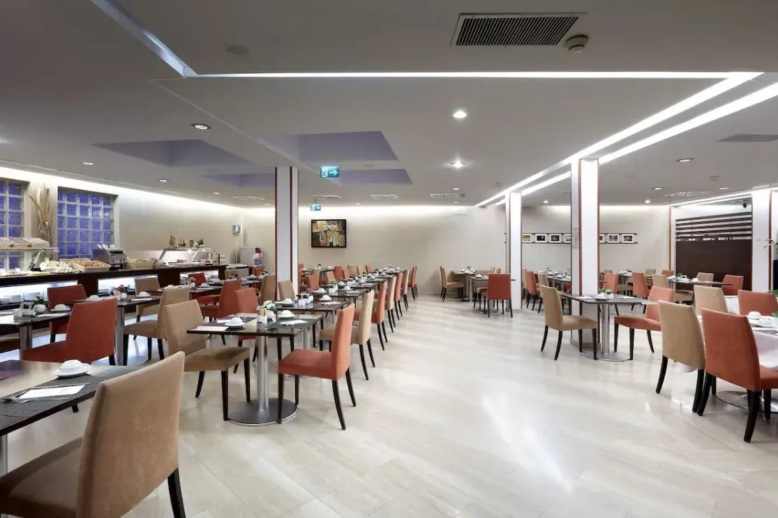 Buffet breakfast with breads, pastries, fruit, cheese and cold cuts at Exe Vienna Hotel